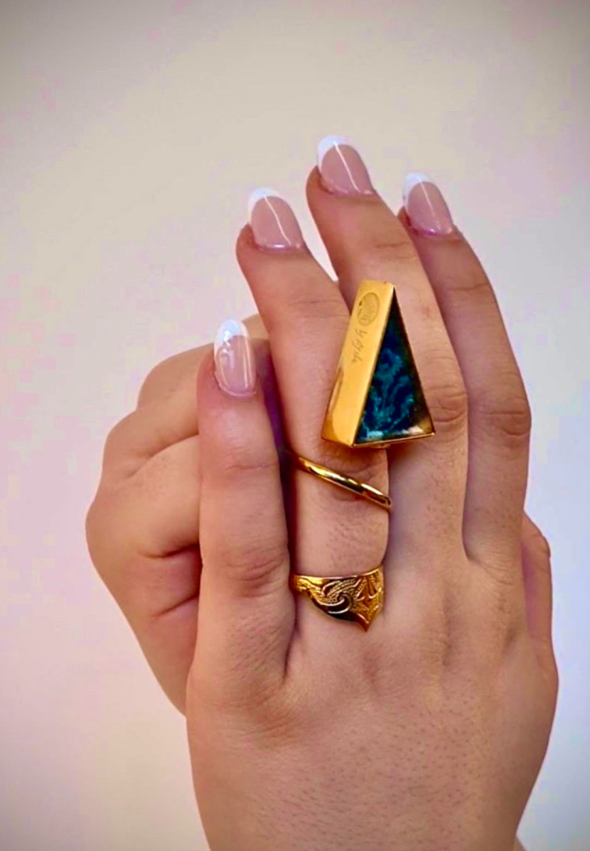 silk road - hand-chased golden ring embracing a triangle silk persian carpet, an exquisite fusion of art and elegance   